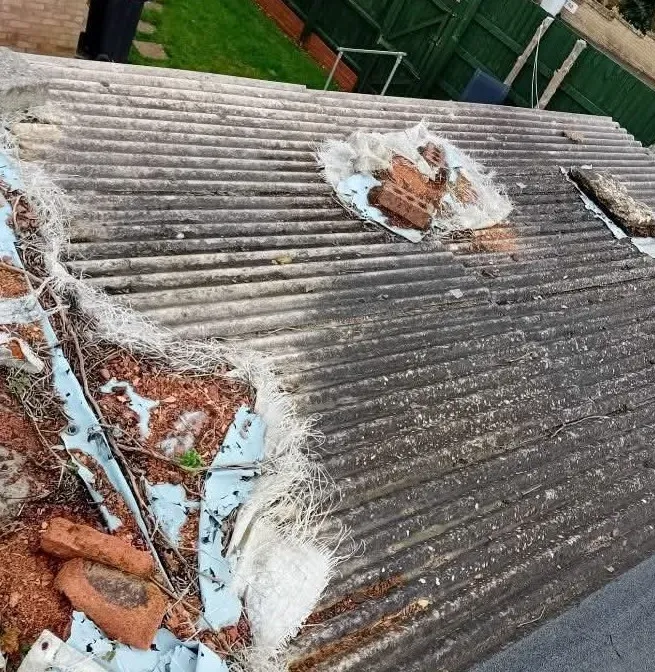 Old asbestos roof replaced: before